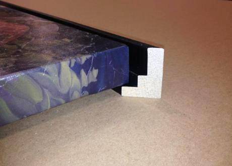 The canvas sits just inside the frame, giving the illusion that it is "floating"